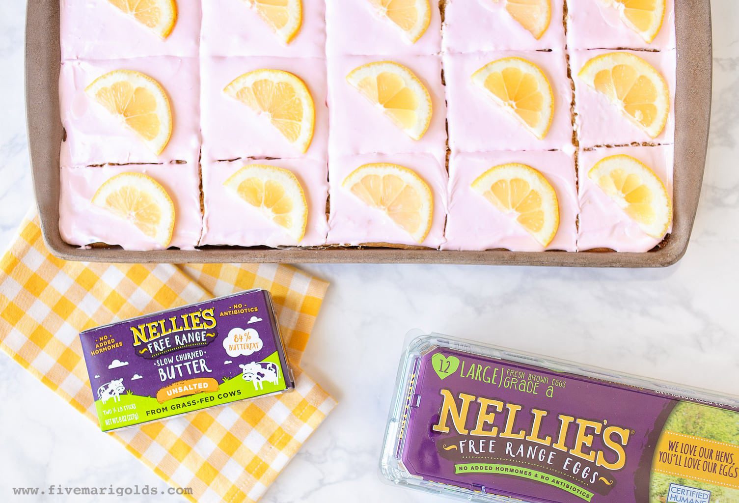 Sheet Cake with pink frosting and lemon slices