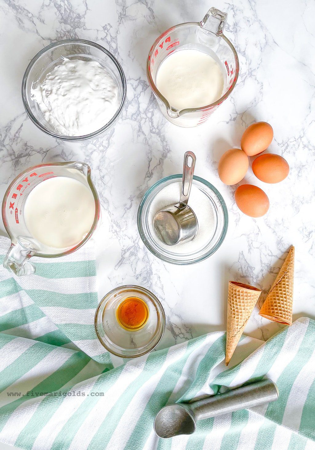 Ingredients in bowls on table to make marshmallow ice cream