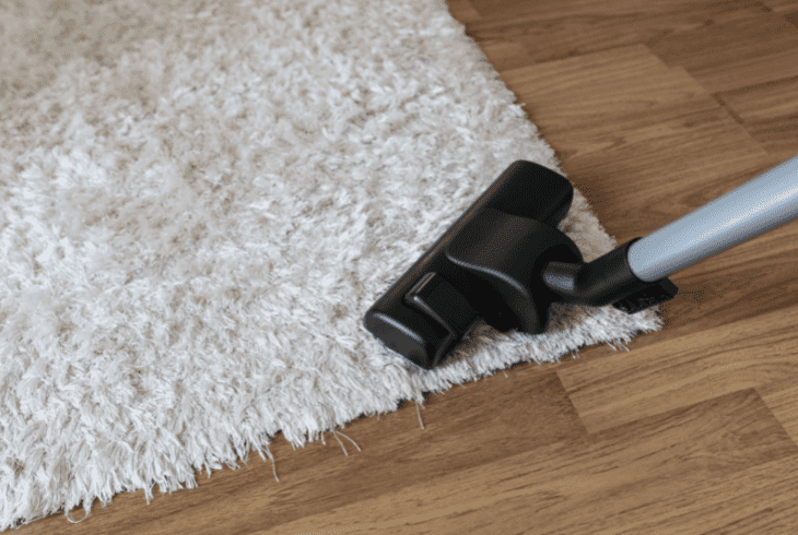 vacuuming carpet