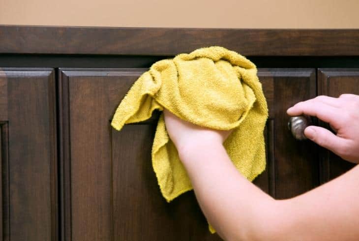 wiping coat on cabinet