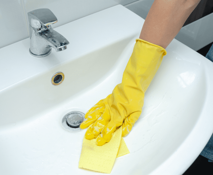 cleaning the bathroom sink