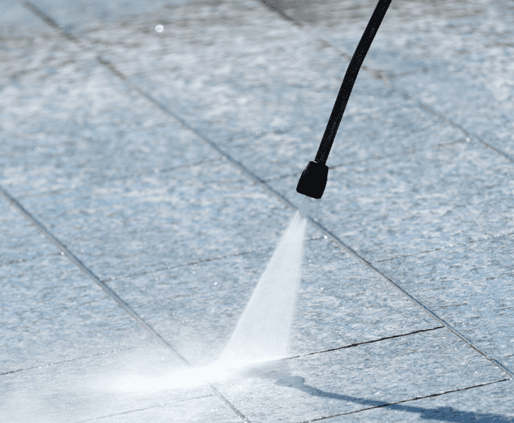 clean concrete with pressure washer
