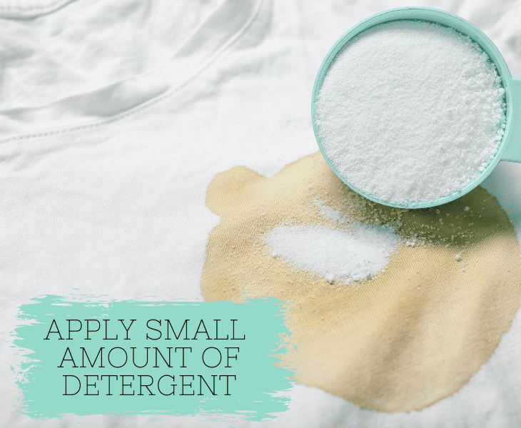 applying detergent to the clothes