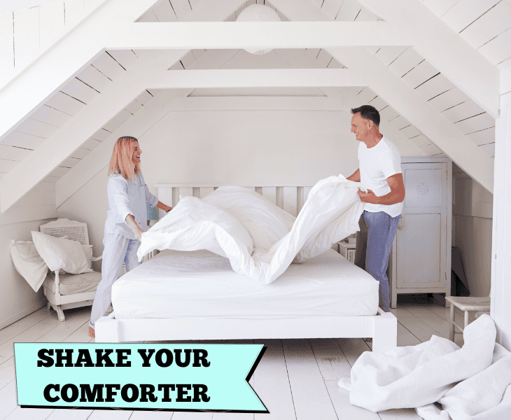 shaking the comforter with two person