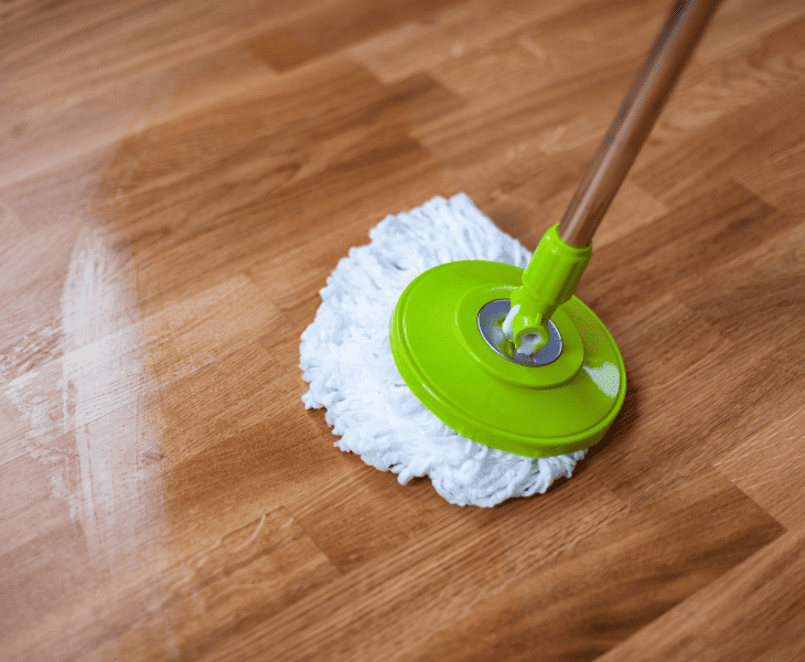 sweeping the oil spill
