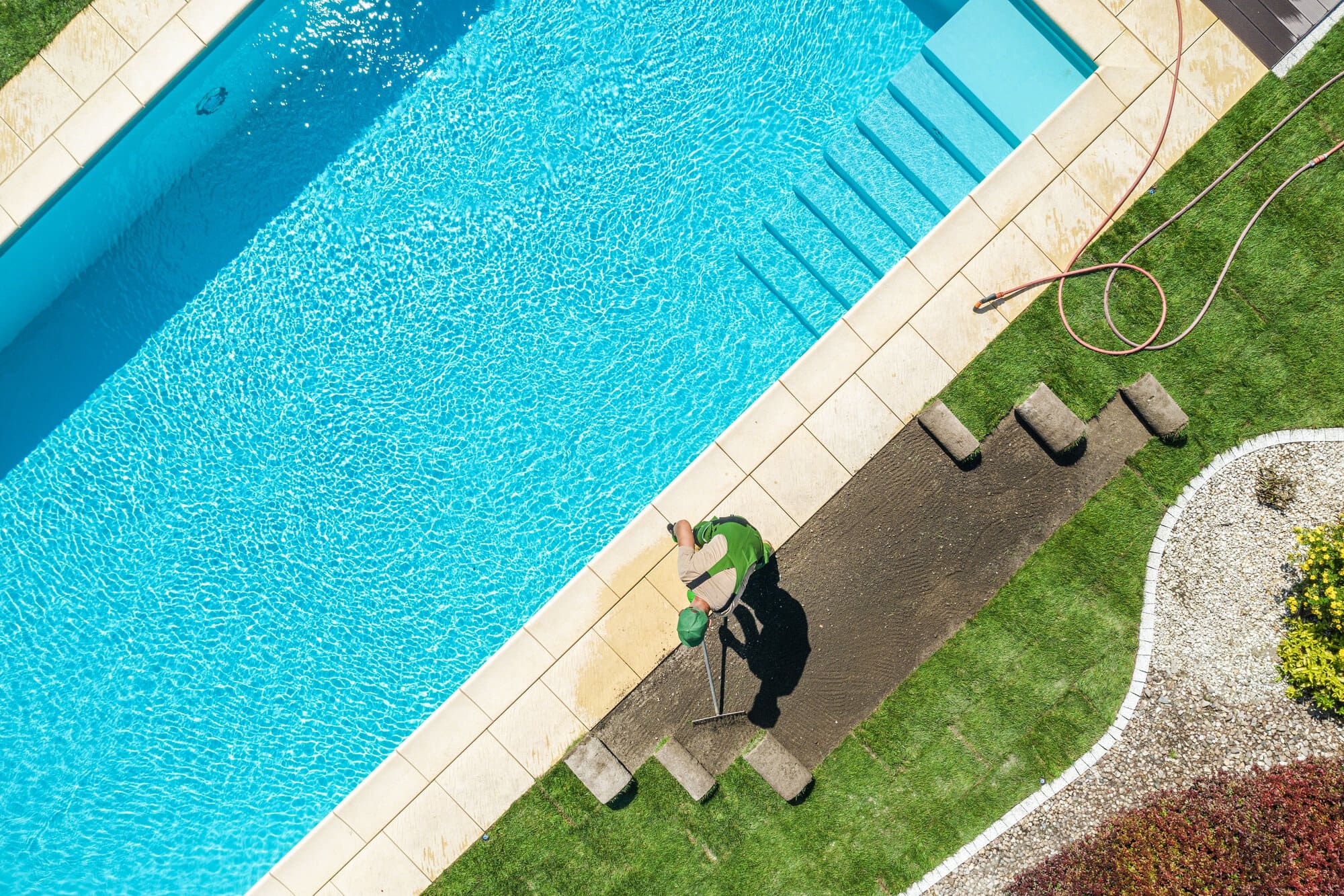Residential Backyard Garden with Pool New Natural Grass Installation
