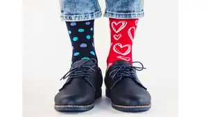 Fun mismatched socks with hearts and polka dots, showcasing unique style.