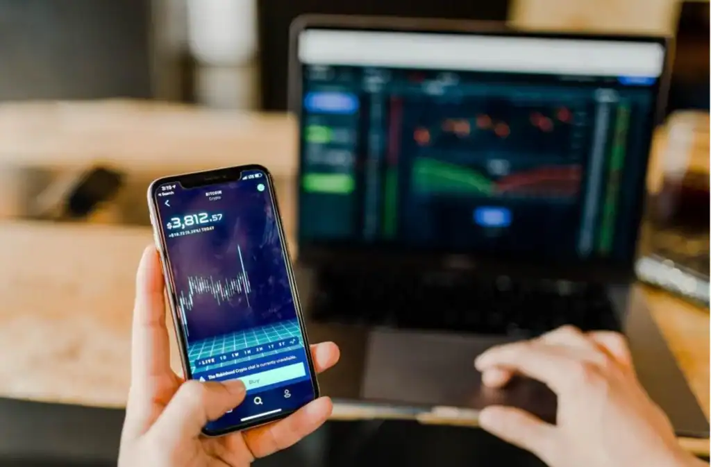 Revology Analytics financial data analysis on mobile and laptop screens.