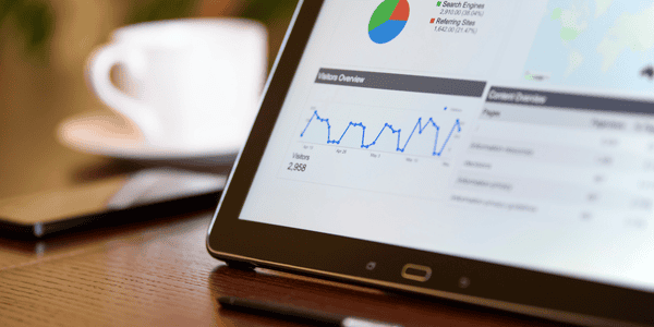Business analytics dashboard showing data trends and insights on a tablet screen.