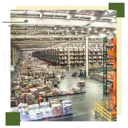 Large wholesale distribution warehouse with organized pallets and shelving units.
