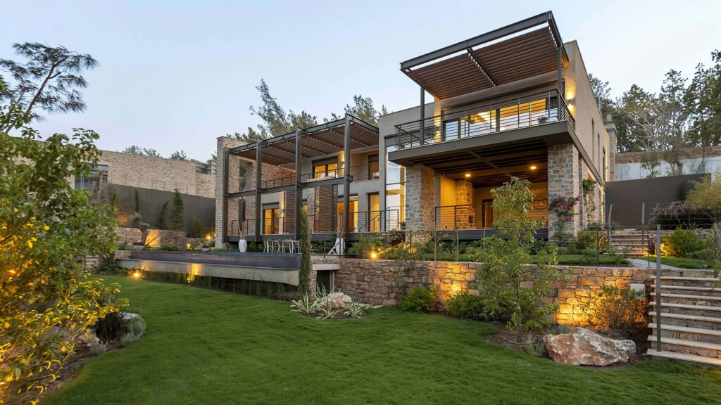 Feature home with illuminated landscape