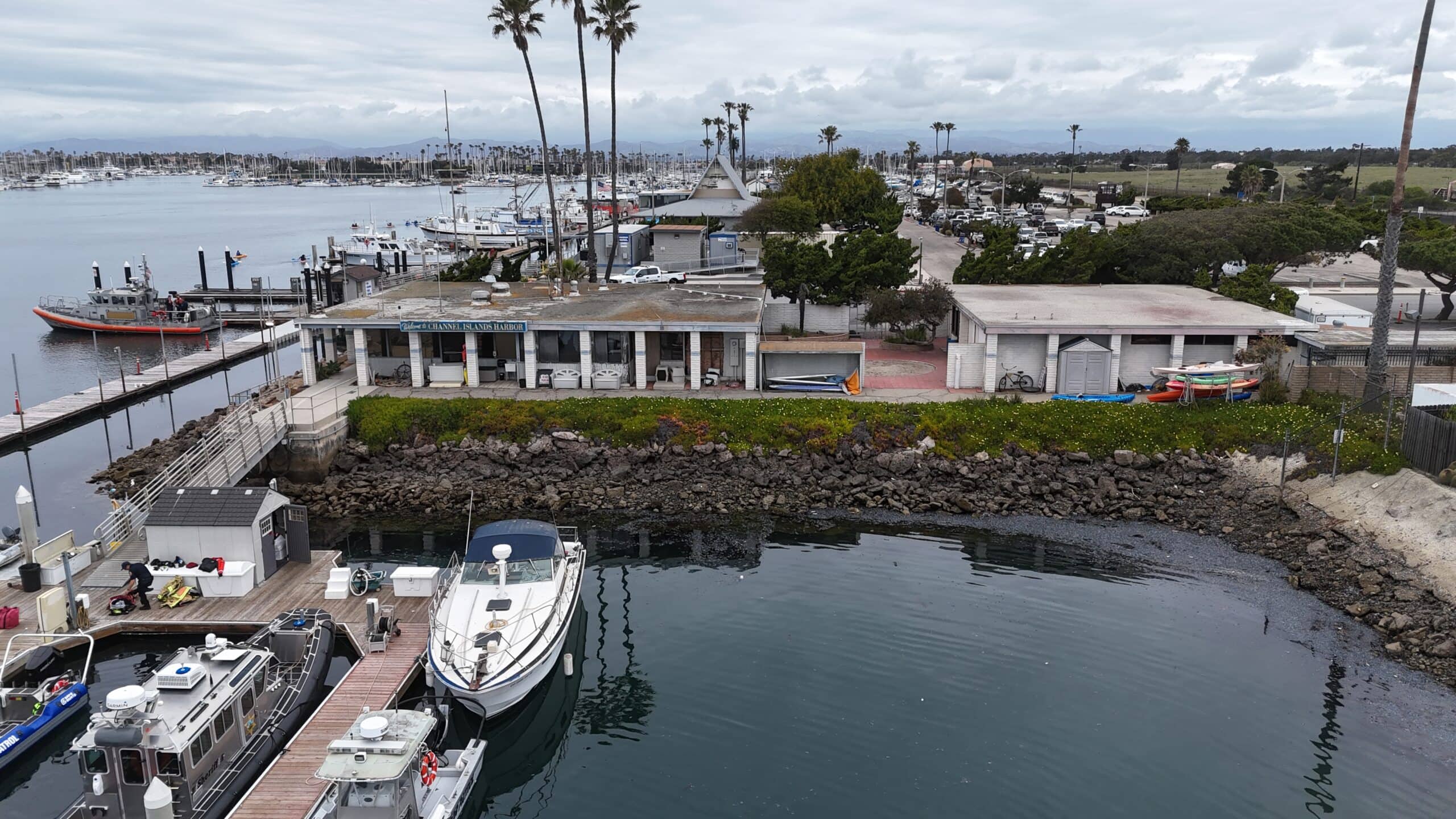 View of Channel Islands Harbor with boats, docks, and palm trees in California.