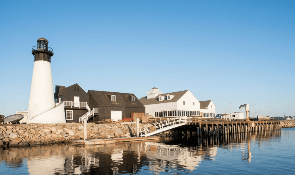 Scenic view of Channel Islands Harbor with lighthouse and pier on a clear day.