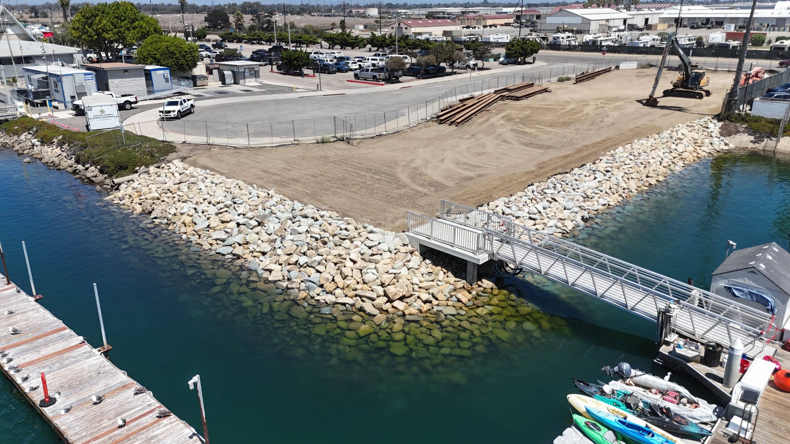 Construction site at Channel Islands Harbor with boats and waterway.