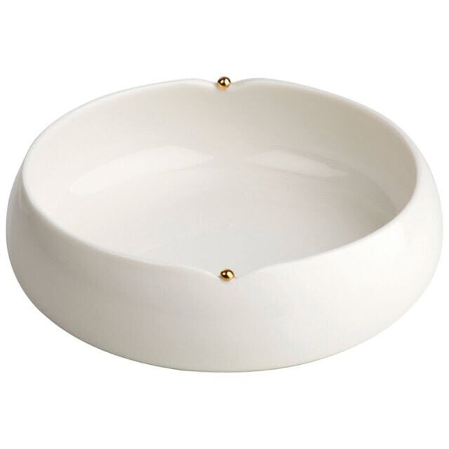 Skål i keramik med elegant design og gyldne detaljer.