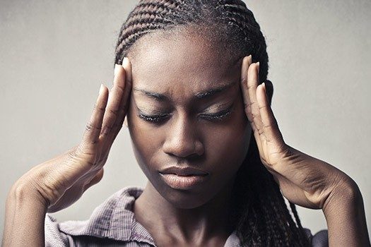 Picture of a lady in pain for blog on recurring UTIs and how to treat them