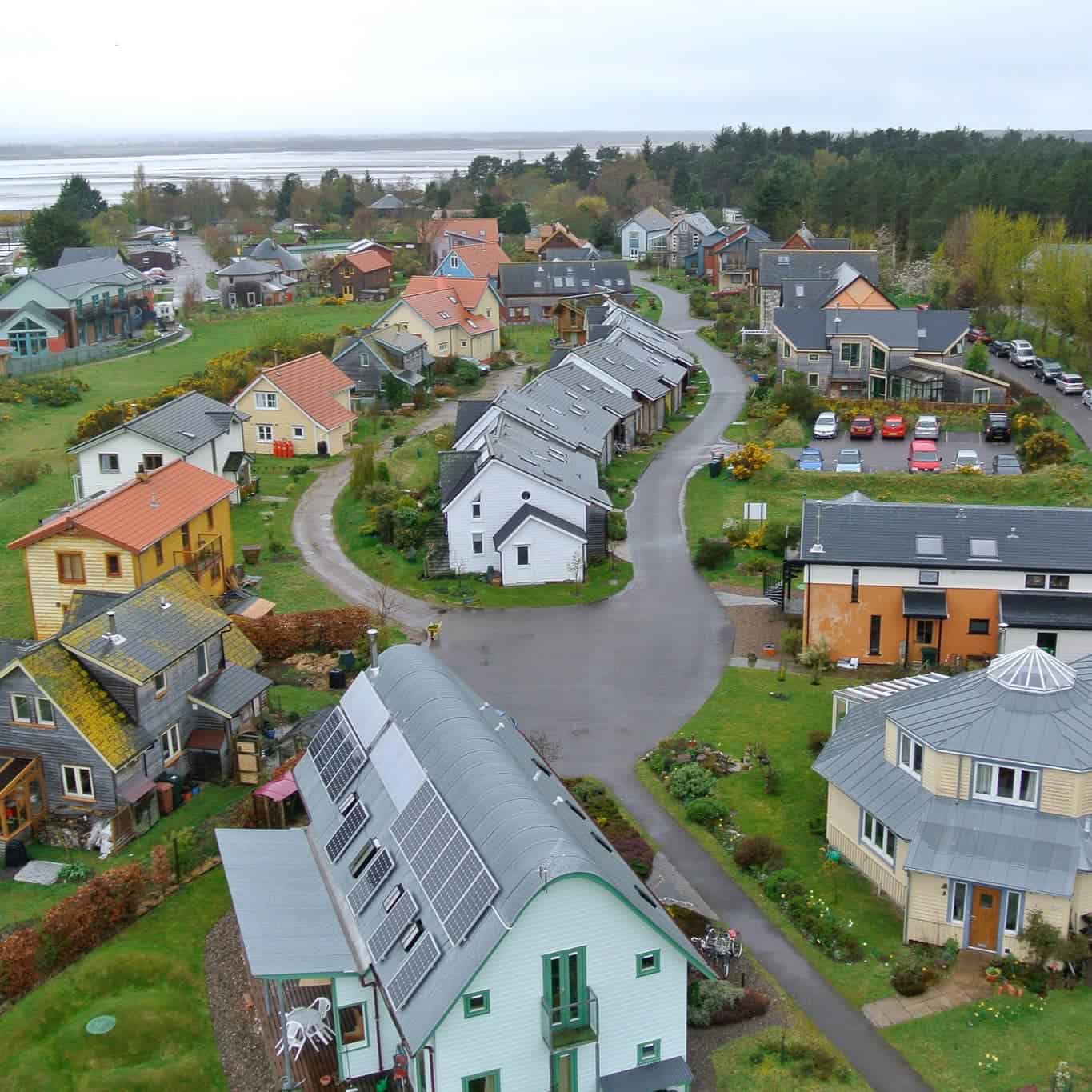 Aerial view of eco-friendly houses in a sustainable community.