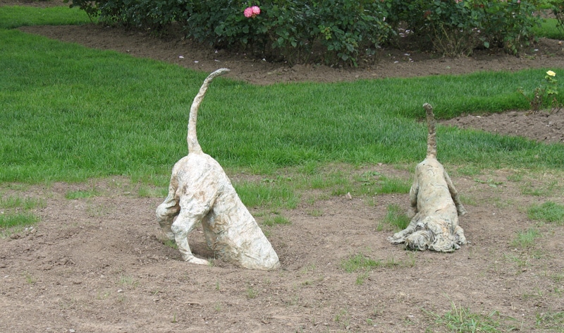 digging dogs garden statues