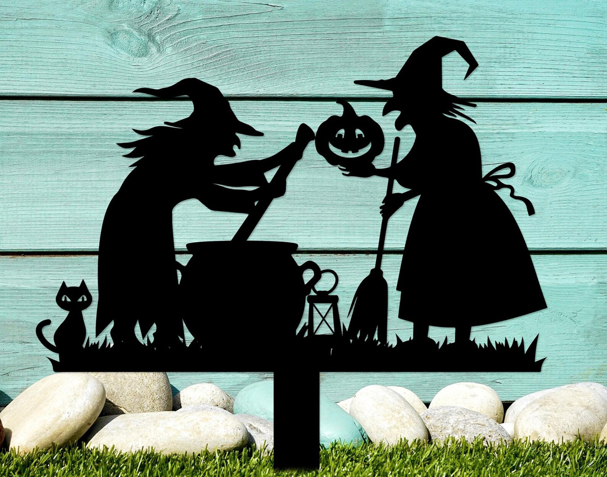 two witches at a cauldron garden stake
