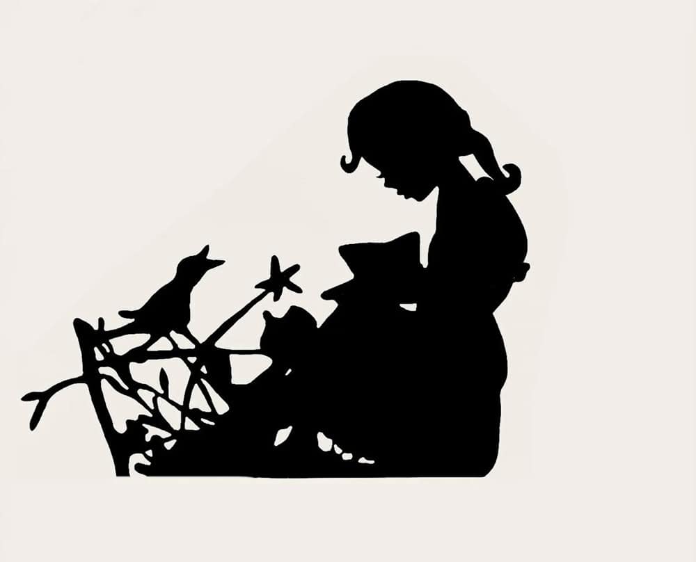Girl reading to her bird metal garden sculpture