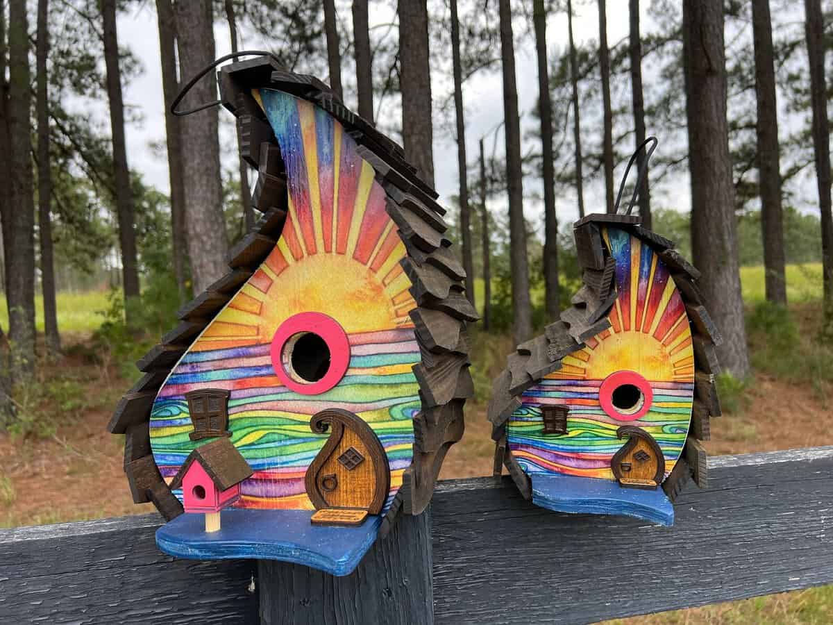 wood birdhouse with sun design on front