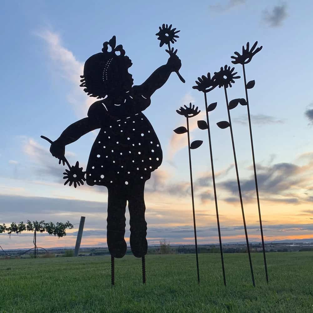 girl with flowers silhouette garden stake