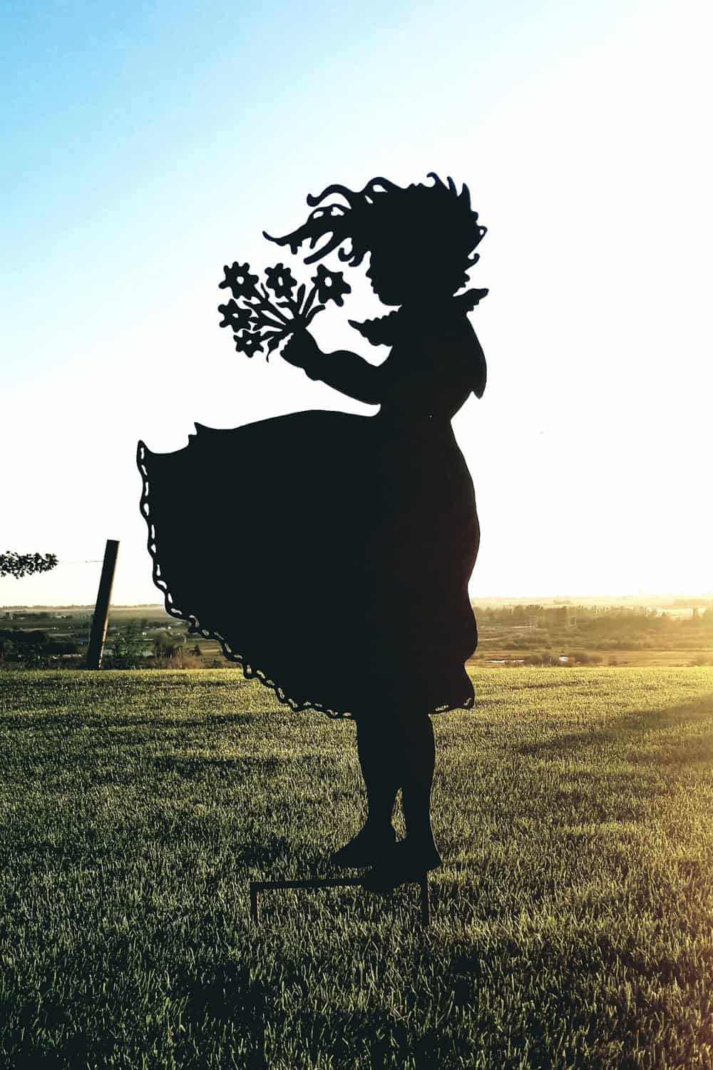 girl with flowers silhouette garden stake