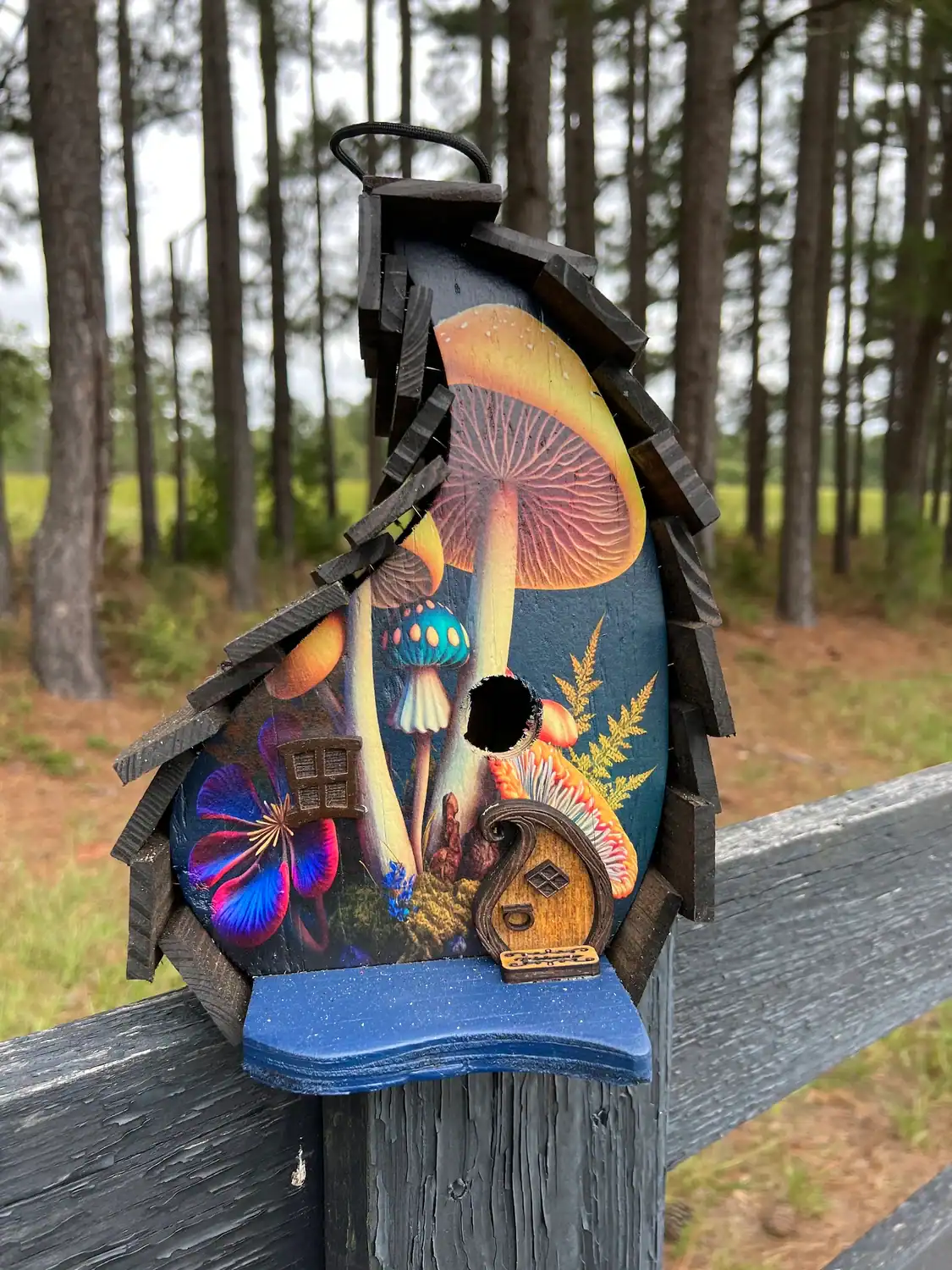 funky mushroom themed birdhouse