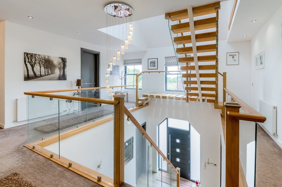 Photograph of a beautiful galleried landing with a view of the entrance atrium