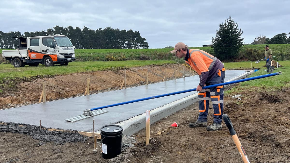 Concrete paving process on construction site by Graham Harris in NZ, skilled work in groundwork and civil engineering.