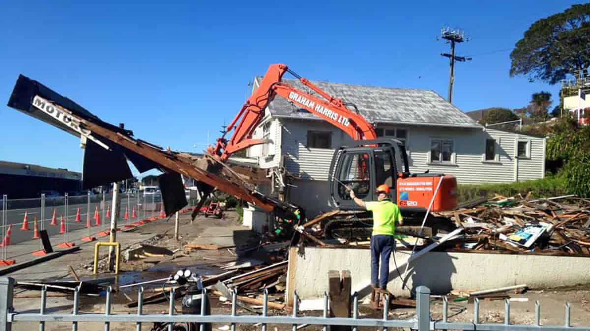 Heavy machinery demolishing a building in Christchurch, New Zealand.