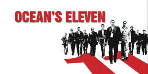 Group of men walking confidently on a red and white striped path, promoting Ocean's Eleven review po.