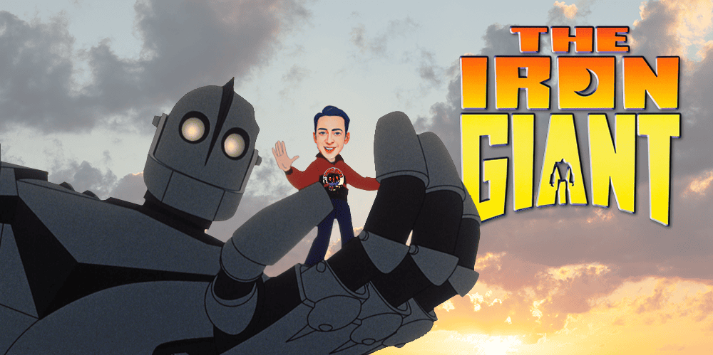 The Iron Giant with animated character waving against a sunset sky background.