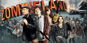 Group of four characters from Zombie Land with zombies in the background, discussing the film.