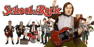 Group of actors dressed as musicians from School of Rock movie, performing with instruments.