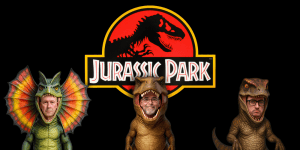 Three hosts dressed as dinosaurs for Jurassic Park movie review podcast.