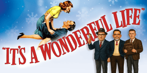 Three men in suits and glasses with a woman in a yellow dress against a snowy background.