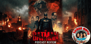 Batman and allies in a fiery cityscape from The Batman movie.