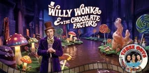 Willy Wonka in the chocolate factory with colorful candies and mushrooms.