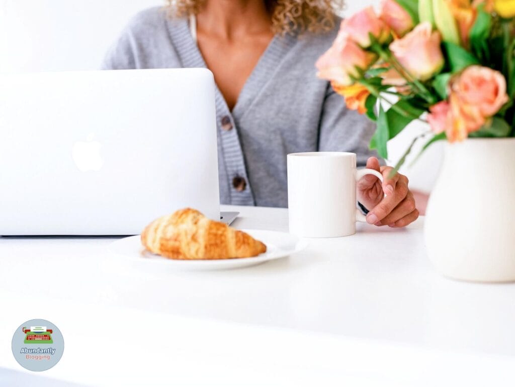 lady behind her desk with a beverage and working through the 8 steps to set goals