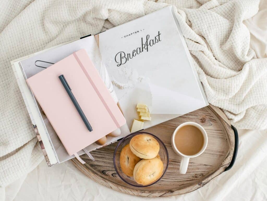 A perfect morning moment: breakfast, coffee, and a book on a tray - Finding your ideal work rhythm