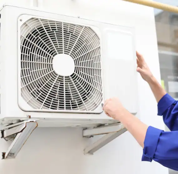 Technician-Inspecting-Outdoor-Air-Conditioning-Unit