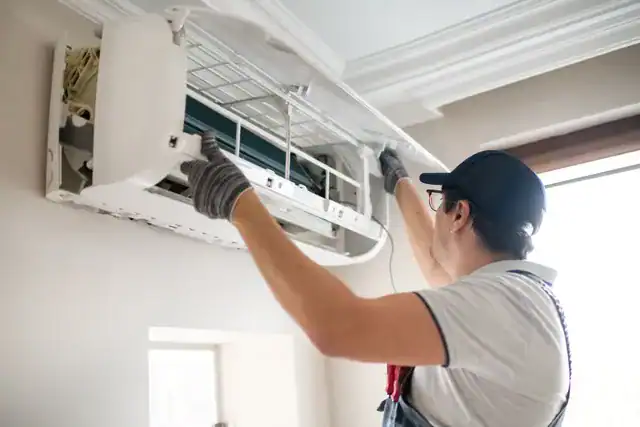 Technician-Installing-Wall-AC-Unit