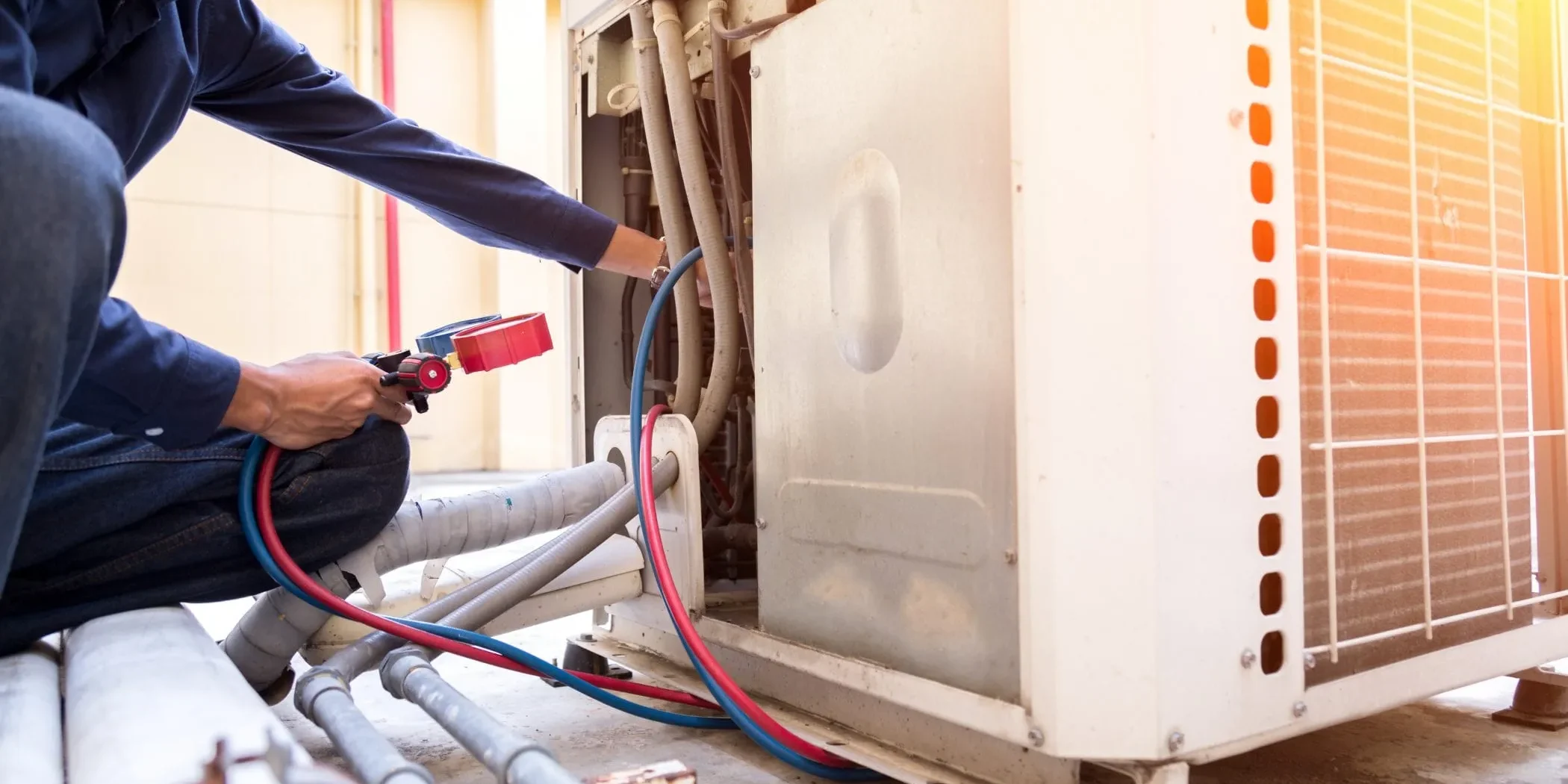 HVAC Technician Servicing Air Conditioning Unit