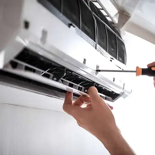 Technician-Repairing-Wall-AC-Unit