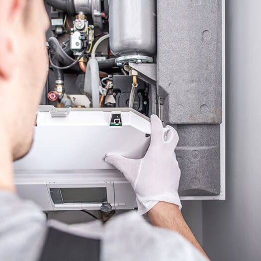 Technician-Inspecting-Furnace-Interior-Components