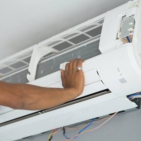 Hand-Adjusting-Wall-AC-Panel