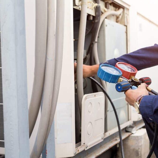 Technician-Checking-AC-Refrigerant-Gauges