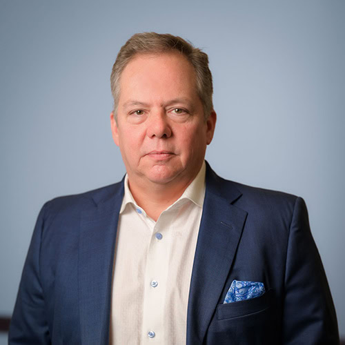 Professional male leader in business attire, representing leadership.
