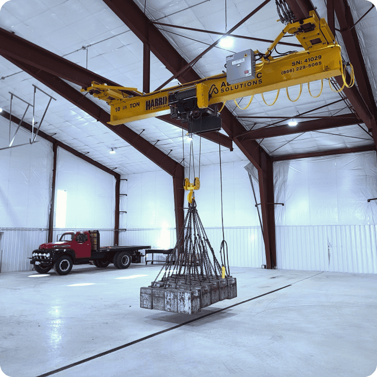 overhead crane in a warehouse lifting cement blocks